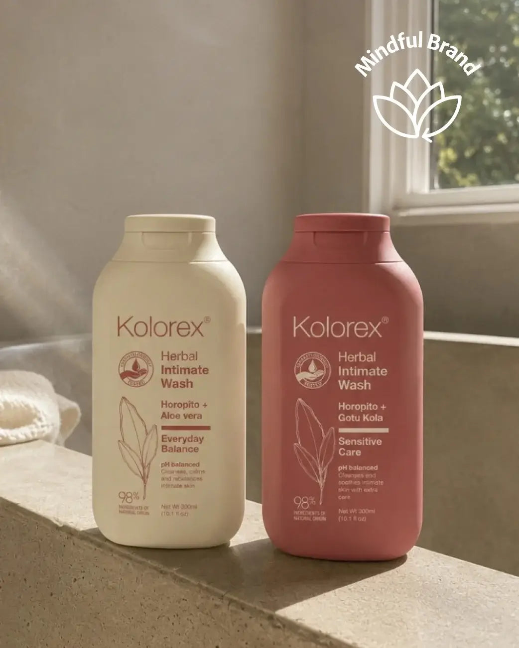Two bottles of Kolorex Herbal Intimate Wash on a surface with a blurred background.
