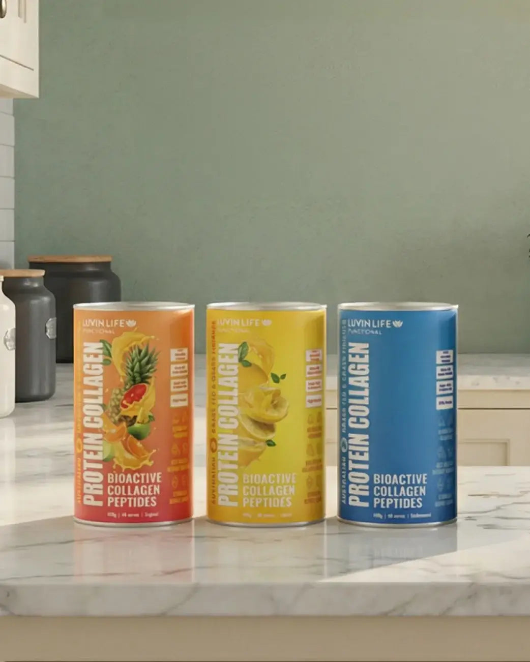 Three cans of Protein Collagen on a kitchen counter with a neutral background.