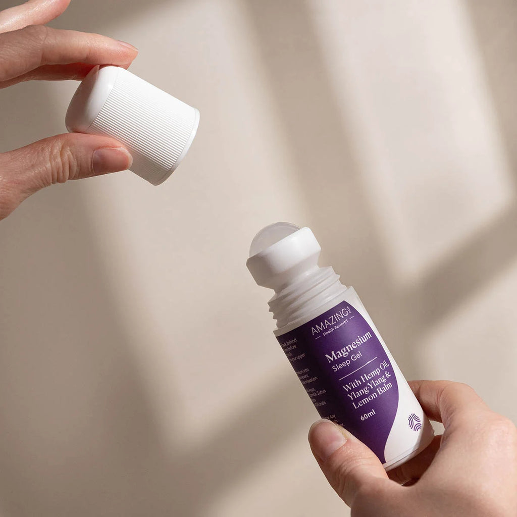 Person holding Magnesium Sleep Gel with lid open. Magnesium gel with hemp  oil, ylang-ylang & lemon balm.