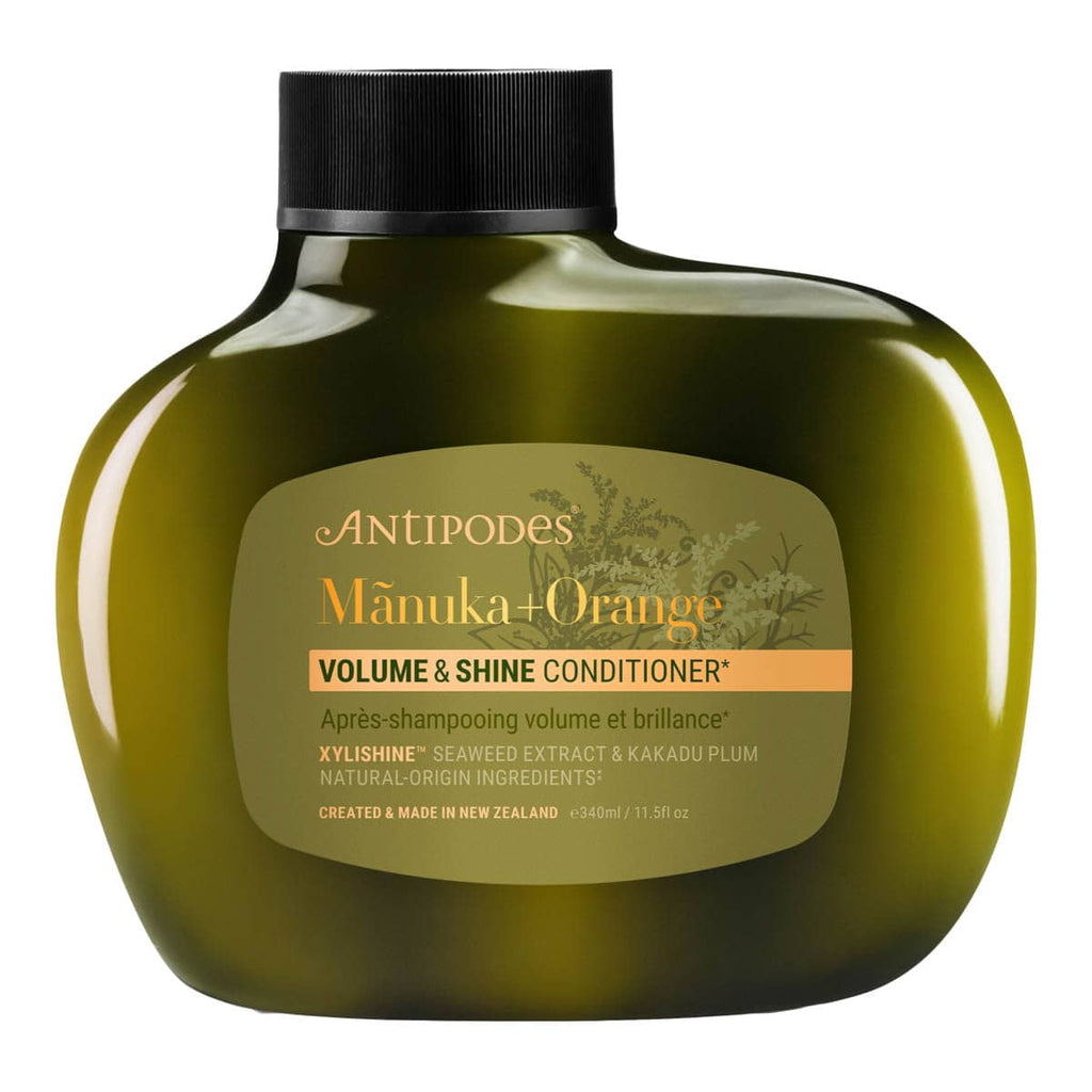 Antipodes Manuka + Orange Volume & Shine Conditioner bottle on a white background.