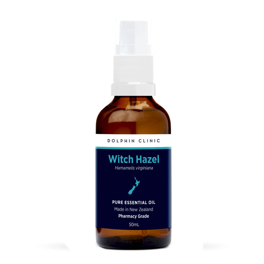 Bottle of Witch Hazel essential oil spray with a white cap on a white background