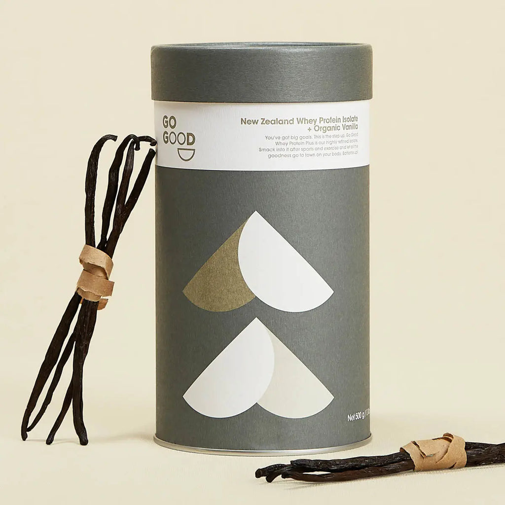 Container of Whey Protein Isolate on a cream background with vanilla beans surrounding it.